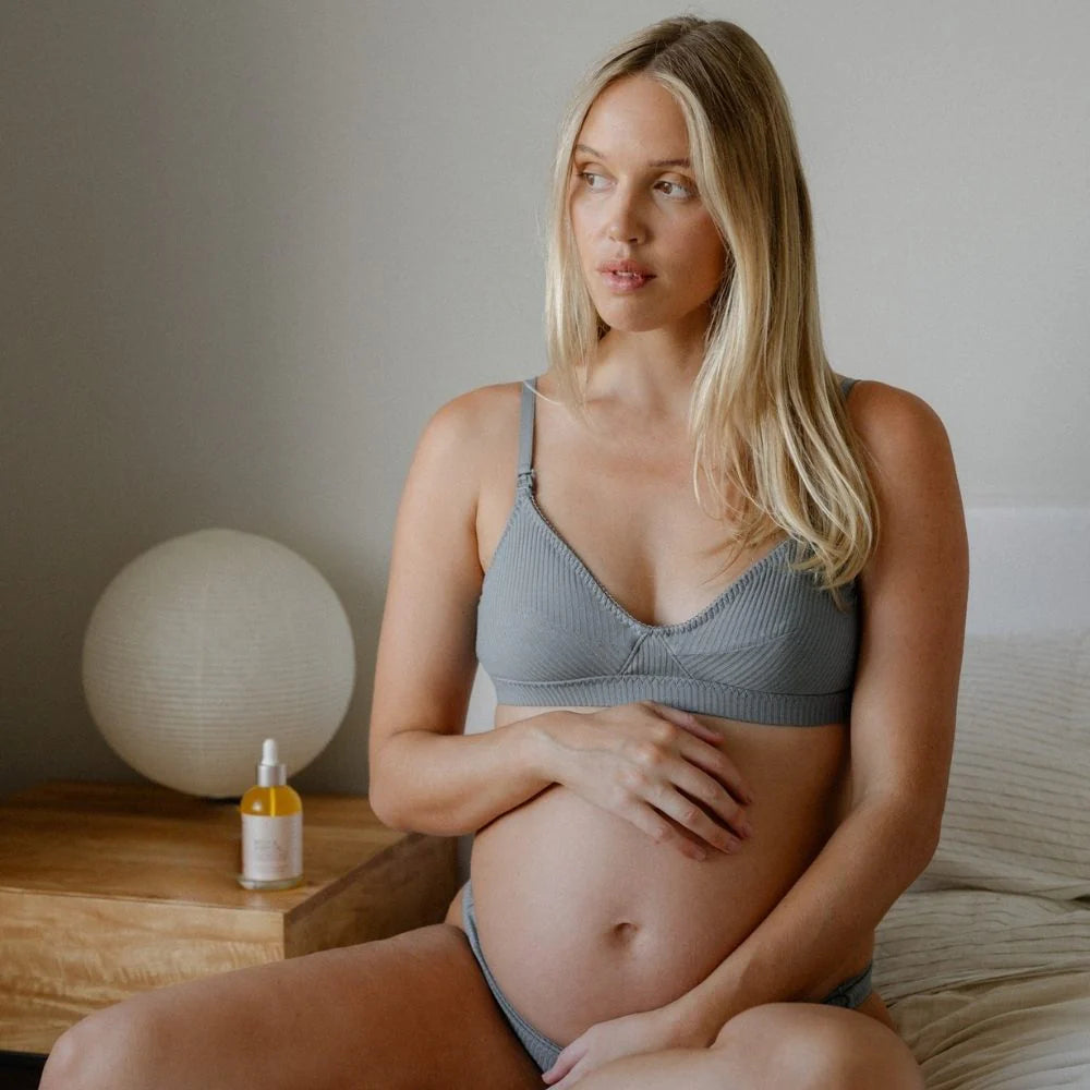 Pure Mama Belly & Body Oil for women, featuring a 145ml bottle of stretch mark prevention and firming skincare.