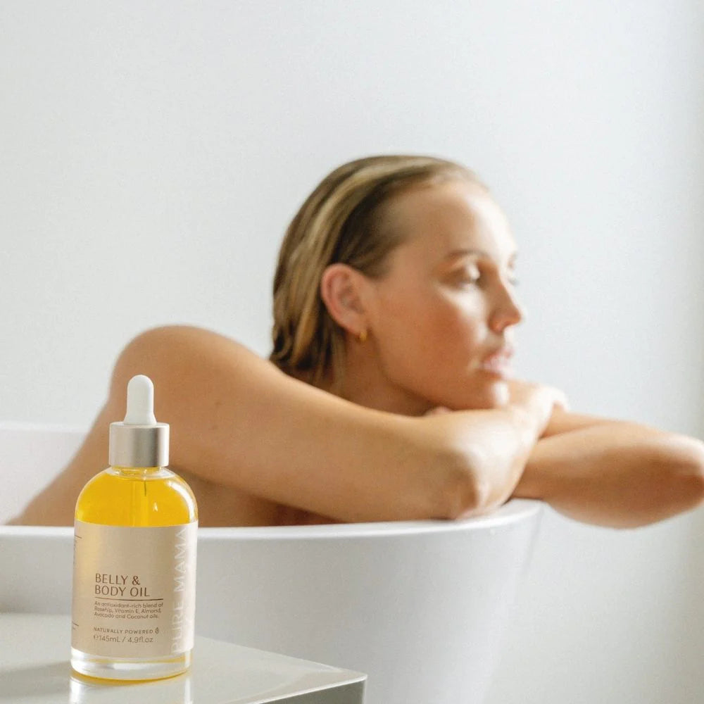 Pure Mama Belly and Body Oil for women, 145ml, featuring a sleek bottle with a natural, nourishing skincare formula for stretch marks.