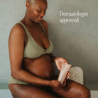 Pure Mama Bump Scrub for women care, 200ml bottle, showing the product with natural ingredients and textured scrub surface.