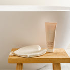 Pure Mama Bump Scrub for women, 200ml, natural stretch mark body scrub in a white jar with a pump dispenser.