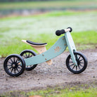 Kinderfeets Tiny Tot Sage Green trike and balance bike for toddlers, featuring a sturdy frame and adjustable seat for young children.