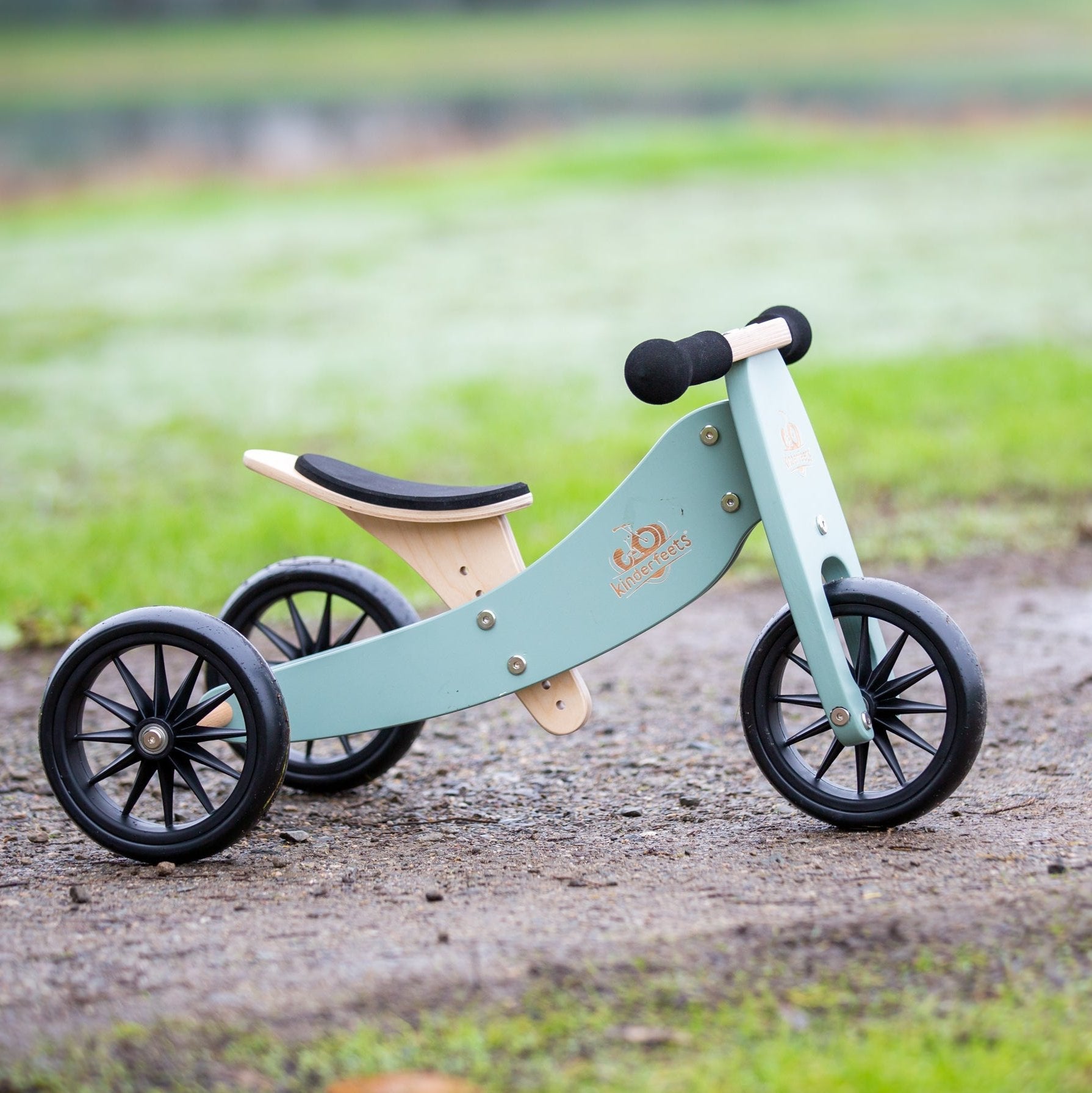Kinderfeets Tiny Tot Sage Green trike and balance bike for toddlers, featuring a sturdy frame and adjustable seat for young children.