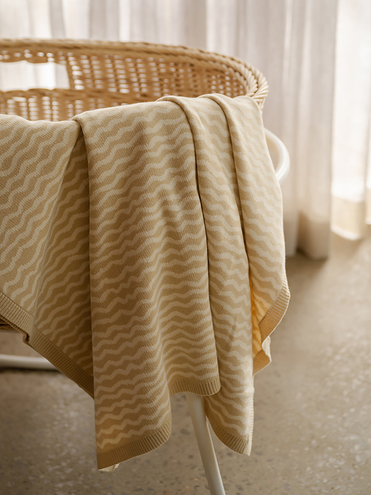 GROWN Organic Knit Baby Blanket in River color, soft and cozy for infants, made from organic materials, displayed on a neutral background.