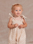 Rylee + Cru Sawyer Shell Check jumpsuit featuring a playful check pattern, long sleeves, and a relaxed fit for kids.