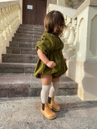 Grech & Co organic cotton over-the-knee tights in buff color, soft and comfortable with a smooth knit texture.