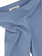 Sonnie Orla ribbed blue bike shorts shown with a close-up of the textured fabric and waistband detail.